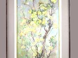 un tableau représentant un arbre aux fleurs jaunes, dans un cadre blanc