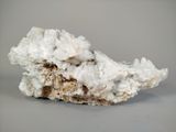 a close up of a piece of rock with a white substance on it