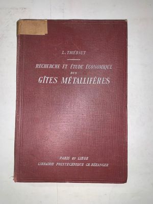 the red book is sitting on a white surface with a brown edge