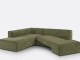 a green sectional sofa with a chaise on it