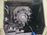 a machine that is working on a piece of machinery