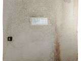 a picture of a dirty bathroom with a window