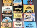 several children ' s books are lined up on a table