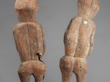 pair of wooden figures of a man and a woman