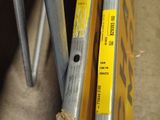 a close up of a pair of metal pipes on the ground