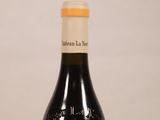 a bottle of wine that is sitting on a table