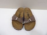 brown birkett sandals with two buckles on the toes