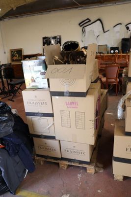 many boxes stacked on top of each other in a room