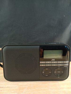 an image of a black radio sitting on top of a wooden table
