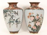 two vases that have birds and flowers on them
