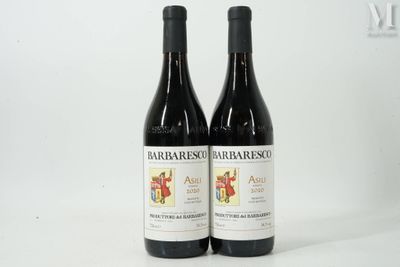 two bottles of red wine sitting next to each other on a table