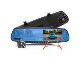 the rear view mirror of a car with a camera attached to it