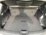 a trunk of a car with the back seats folded down