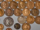 a lot of coins that are on the table