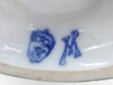 a blue and white plate with two fish on it