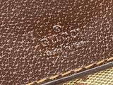 the inside of a brown louis vuitton bag with gold trim