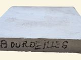 concrete block with the word ' s on it and the word ' s written on it