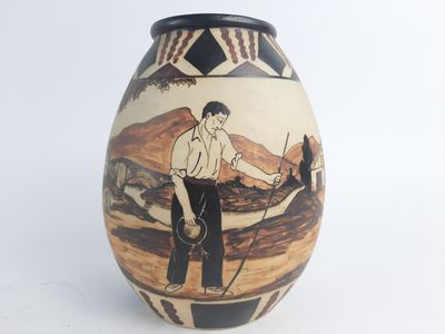 a vase that has a picture of a man on it