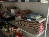 a shelf of food and other items in a store