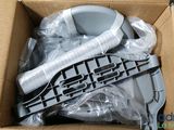 a box with a toilet and a toilet brush in it