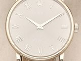 an image of a wrist watch with roman numerals on it