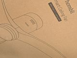 a cardboard box with a pair of headphones on it