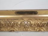 an image of a close up of a gold frame on a wall