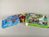two boxes of playmobils on a table
