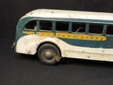 a toy bus that is sitting on a black surface