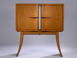 a wooden cabinet with two doors and two drawers