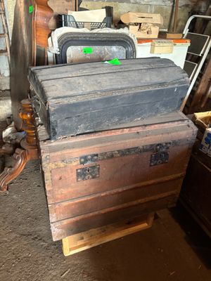 a stack of old wooden boxes sitting on a table