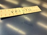 a ruler on a table with the word vauto written on it