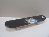 a skateboard with a sticker on it sitting on a table