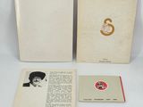 an open book with a picture of a man in a hat and a book with a picture of a man in a top hat