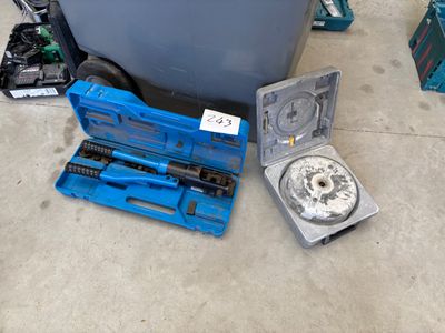 a blue tool box and a tool set on the floor