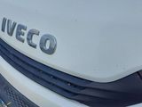 a close up of a white car with the word veco written on it