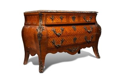 a small chest of drawers with a marble top