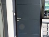 a blue door in a room with a mirror on the wall