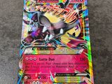 a close up of a pokemon card on a table