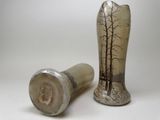 two vases that are sitting next to each other on a table