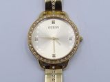 a close up of a gold watch with diamonds on a white background