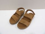 the children ' s sandal is made from sued and has two straps on each side