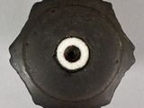 a close up of a metal object with a hole in it