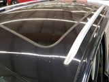 a car that is parked in a garage with other cars