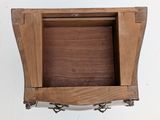 a picture of a wooden shelf with a clock on it