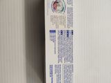 a box of toothpaste sitting on the wall