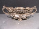 a silver bowl that is sitting on a table