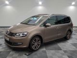 the brown van is parked in a room with a checkered floor