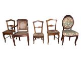 four chairs with upholstered backs and a floral upholstered seat
