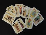 a lot of playing cards on a black table